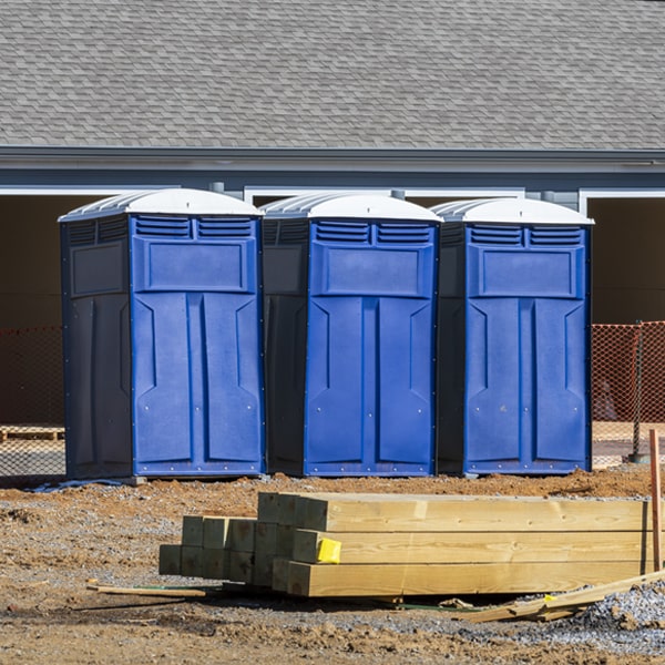 what is the cost difference between standard and deluxe portable toilet rentals in Redland Texas